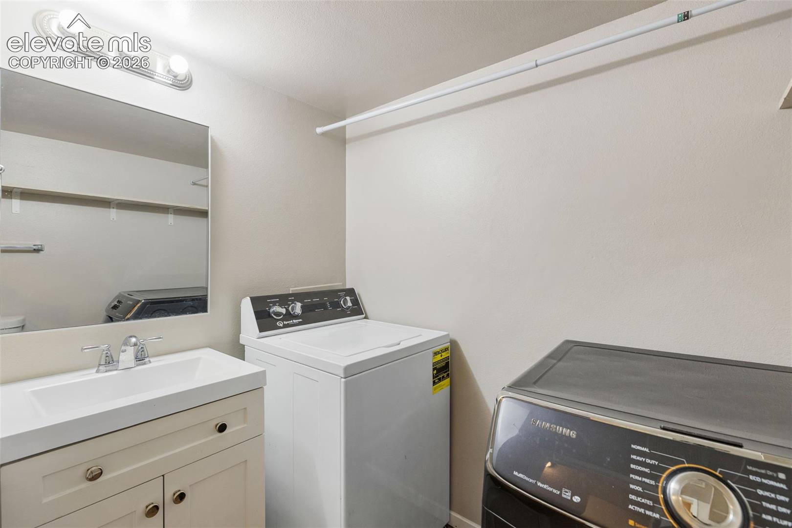 Main-level half bathroom and laundry area
