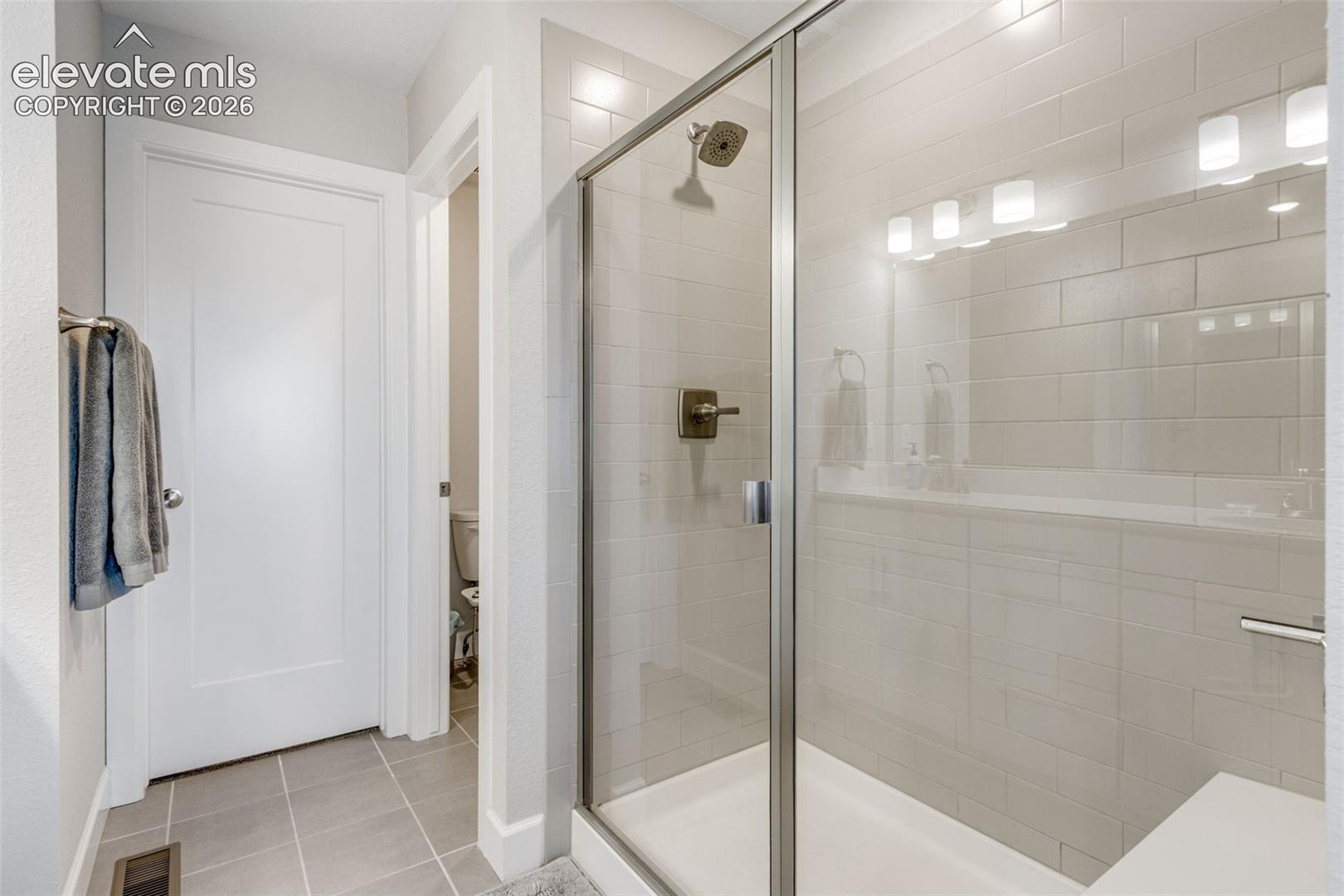 Nice-sized glass shower enclosure.