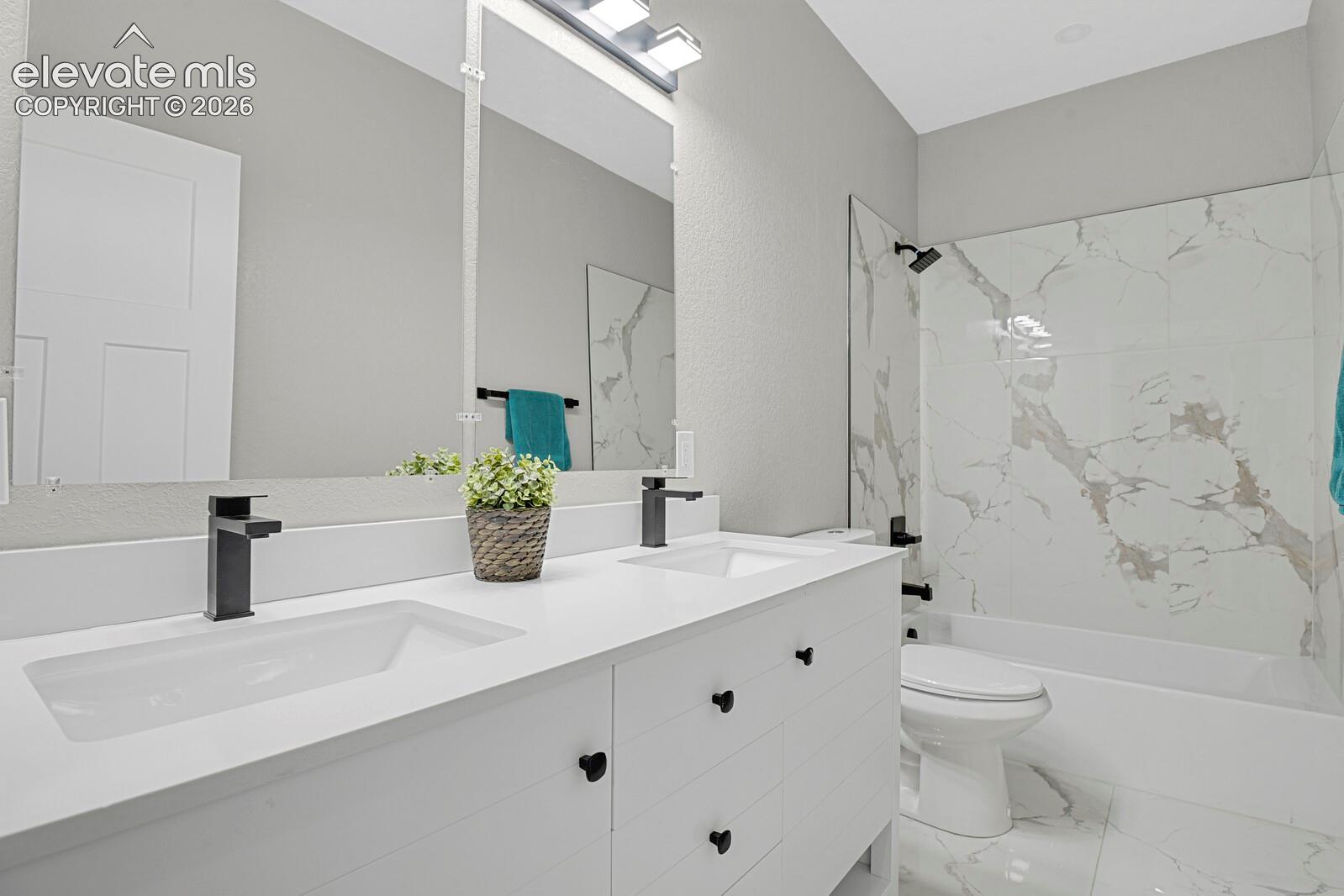Dual vanity with integrated sinks and matte black fixtures