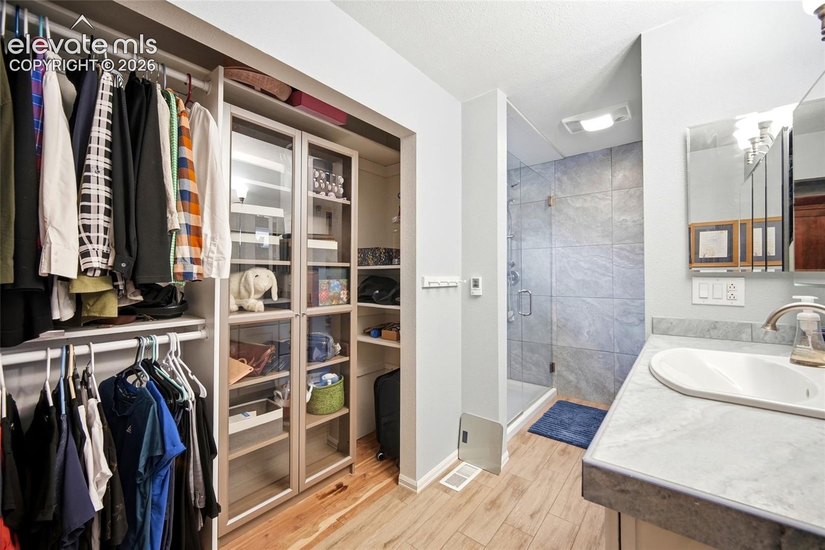 Two closets integrated into the primary bath