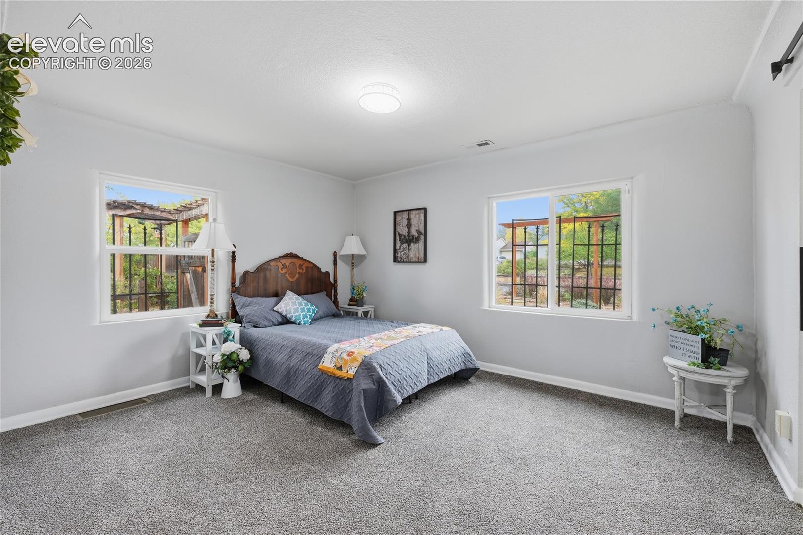 A large primary bedroom with plenty of space for even larger bedroom sets.