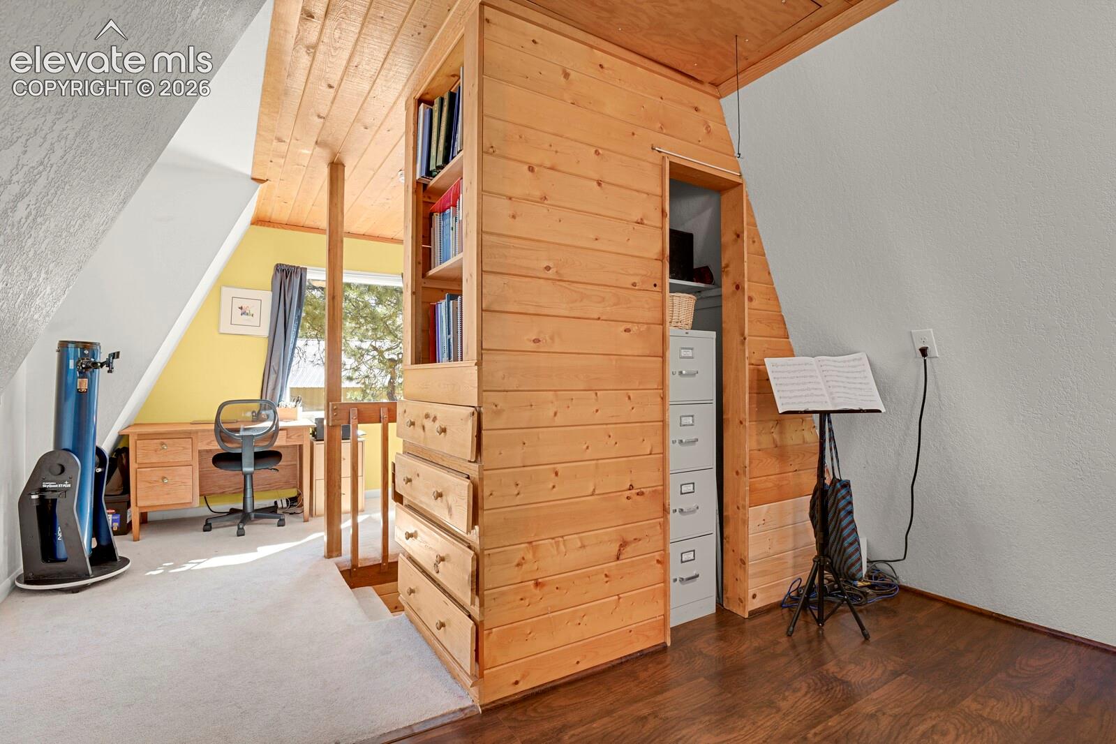 Loft bedroom offers built-in drawers and closet storage; options for many uses including office, schoolwork, reading nook, or playroom