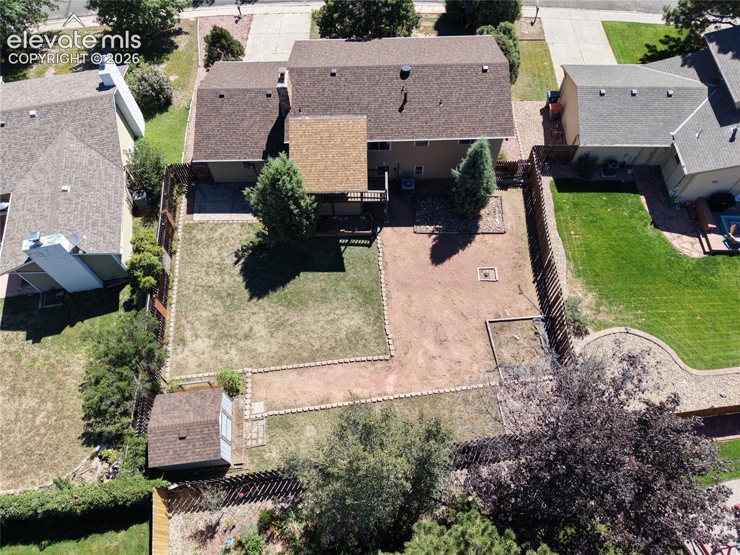 Spacious fenced in backyard and shed.
