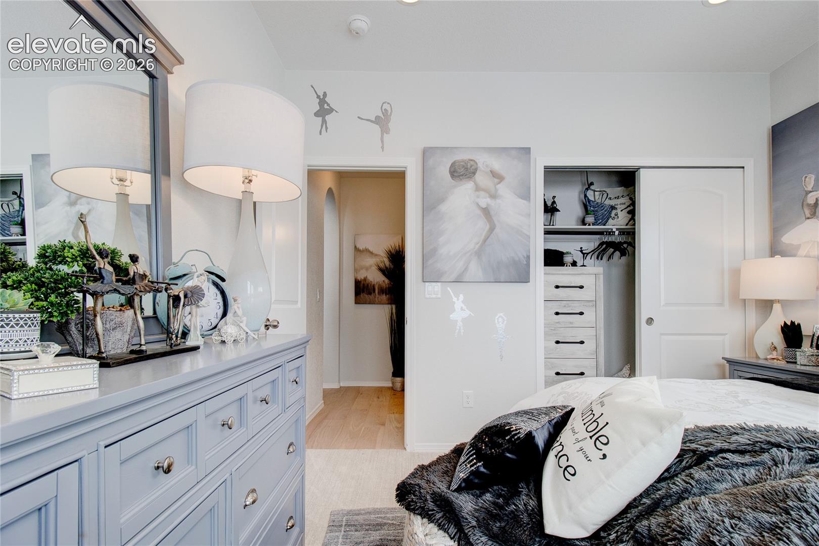 Interior space featuring neutral wall paint, recessed ceiling lighting, and a closet with a sliding door panel