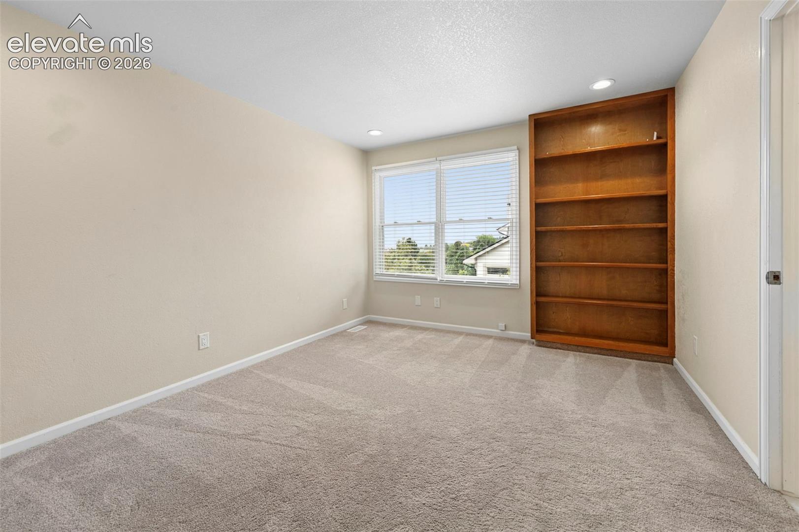 Unstaged upstairs bedrooom