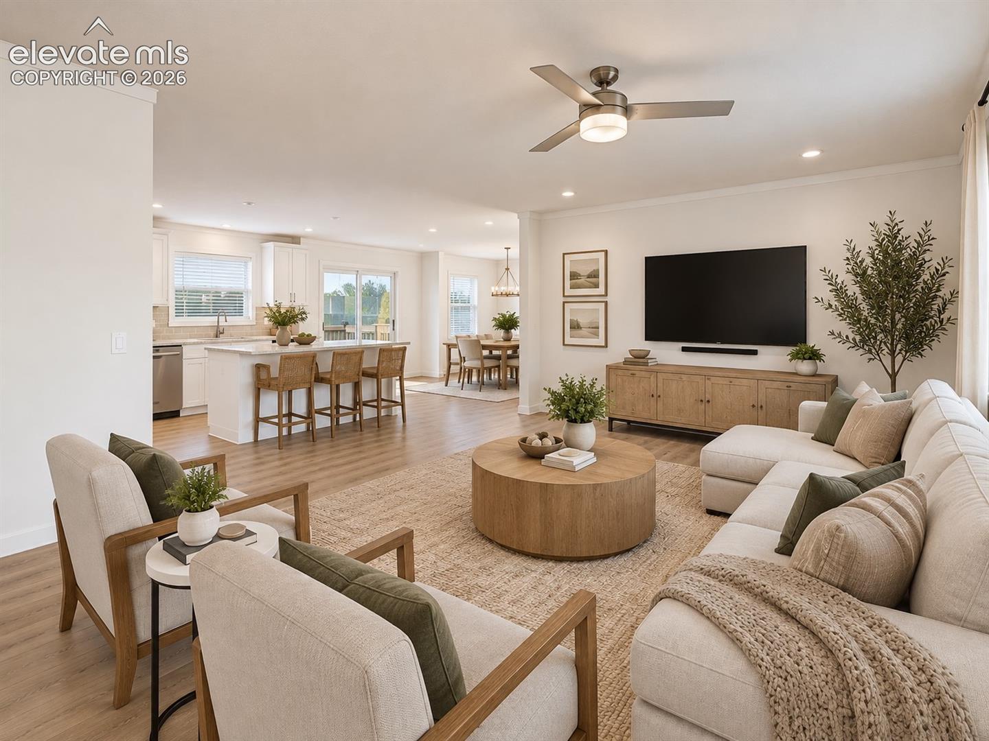 Family Room & Kitchen – Open sightlines connect the living room with the kitchen and dining areas, creating a cohesive layout designed for everyday living and entertaining.