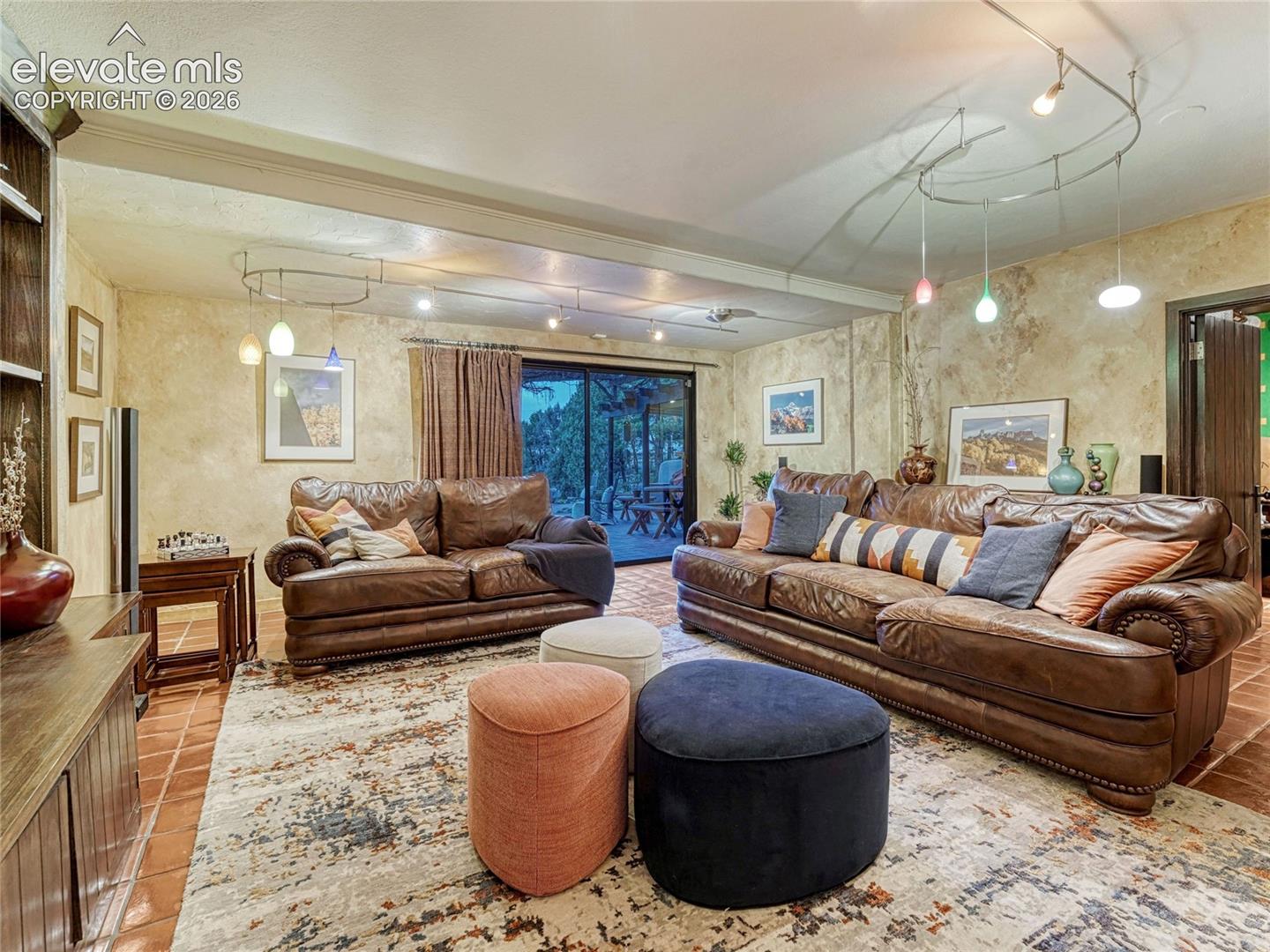 Lower Level Family Room with original terra cotta tile floor.