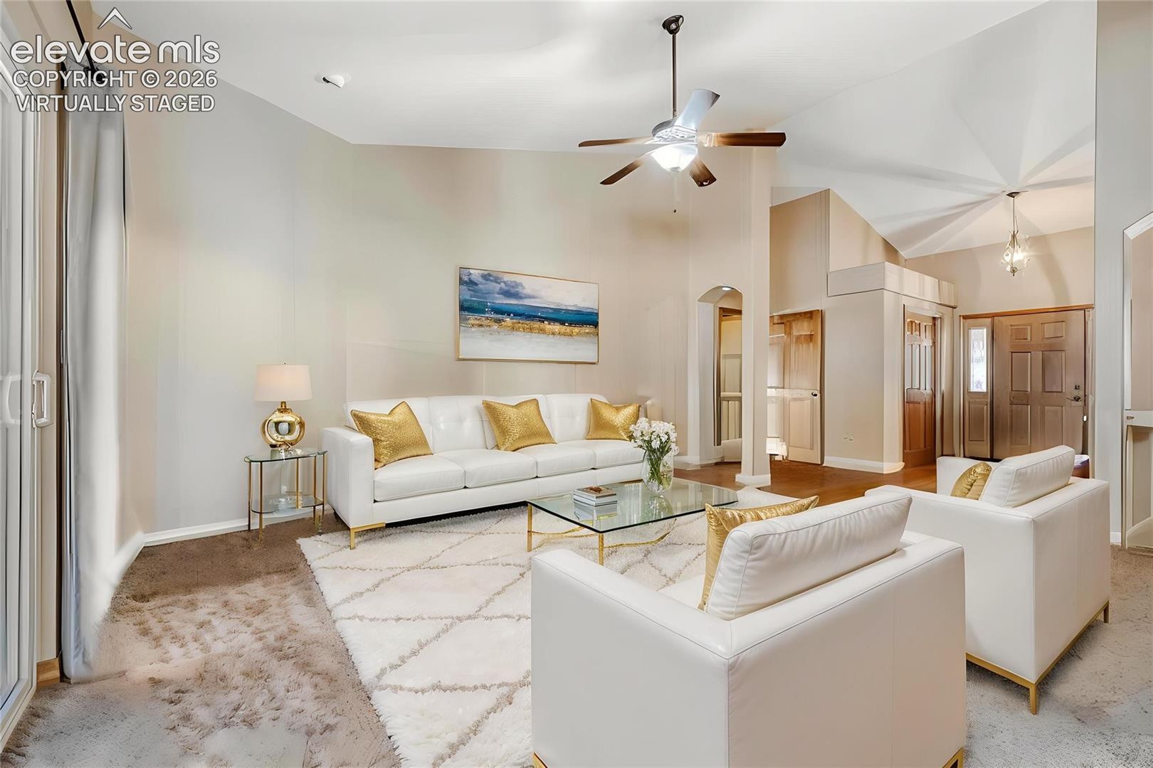 Virtually Staged -Spacious living area featuring vaulted ceilings, a ceiling fan, and recessed lighting