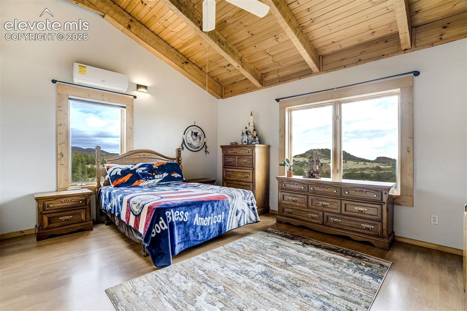 Vaulted wood-paneled ceiling with exposed beams
