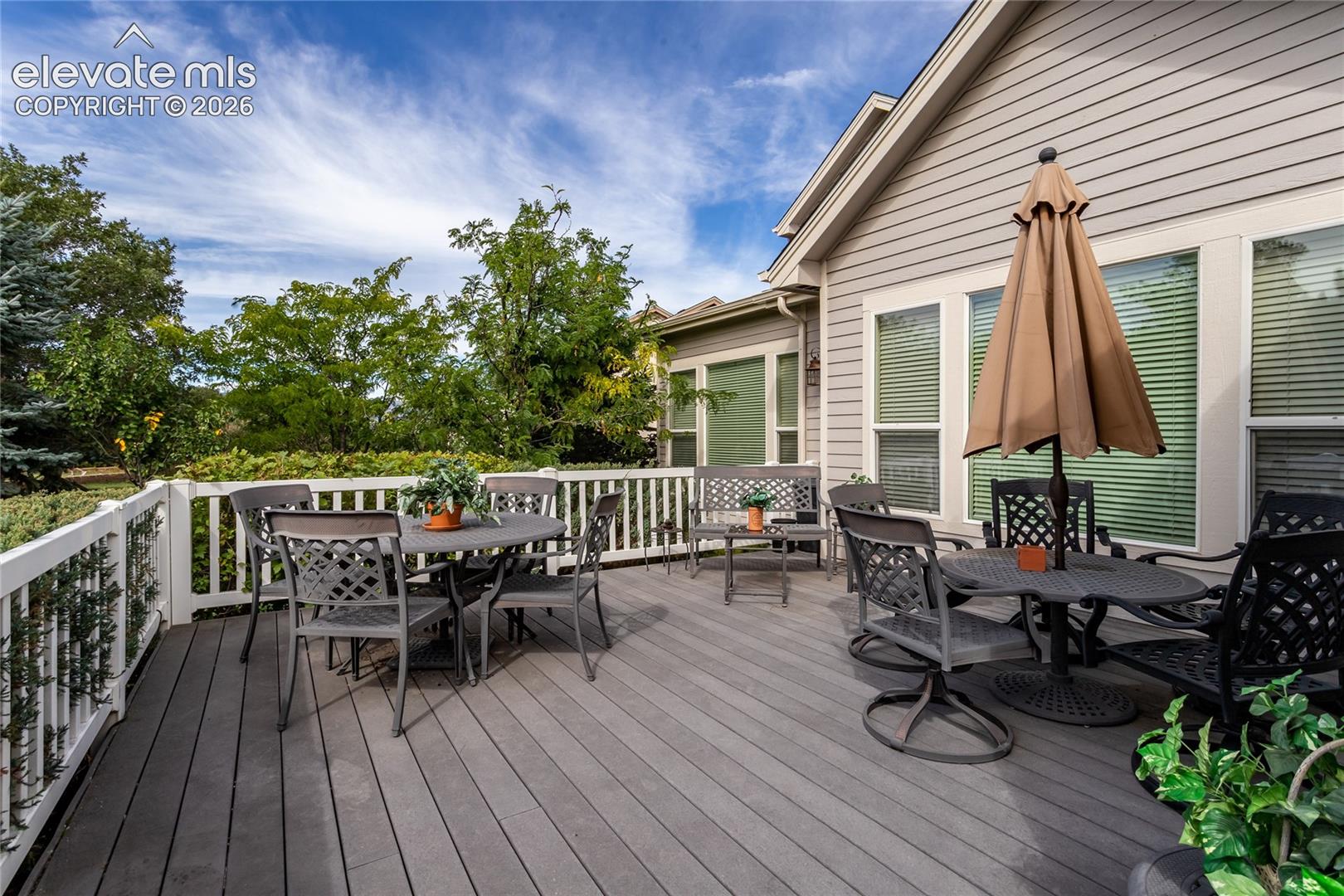 Spacious rear deck is perfect for enjoying this amazing back yard!