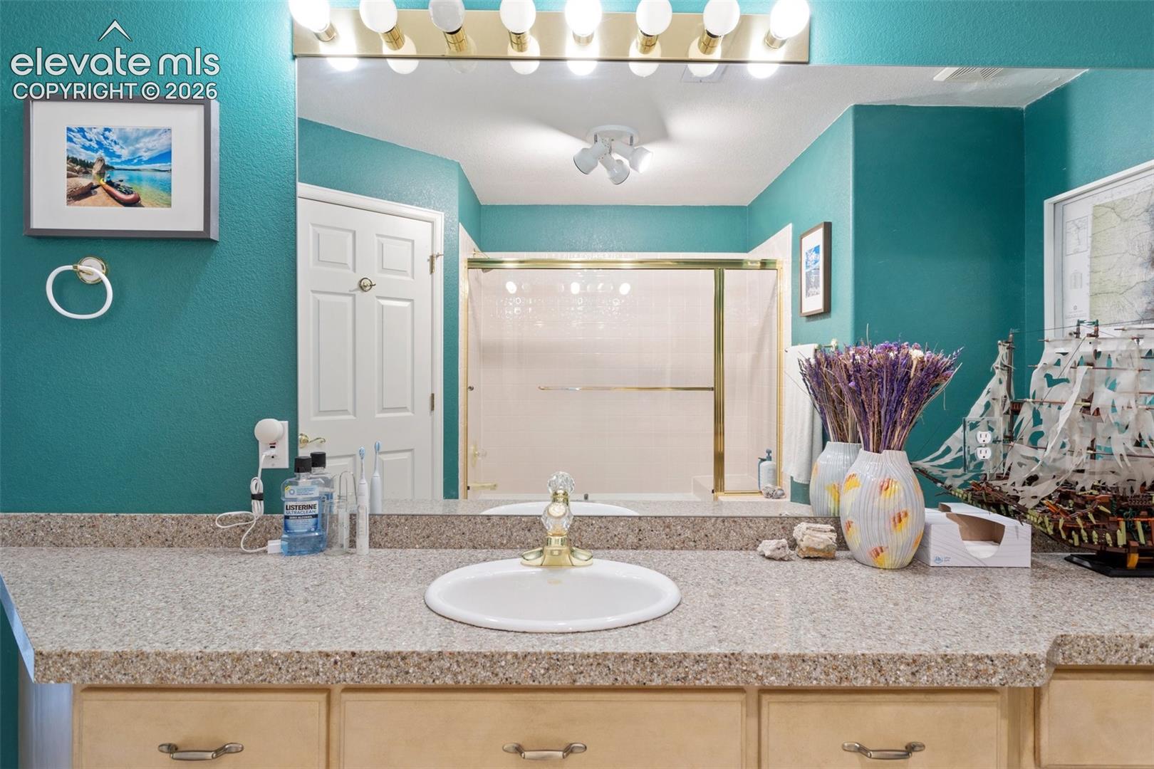Spacious vanity featuring a built-in sink and ample counter space
