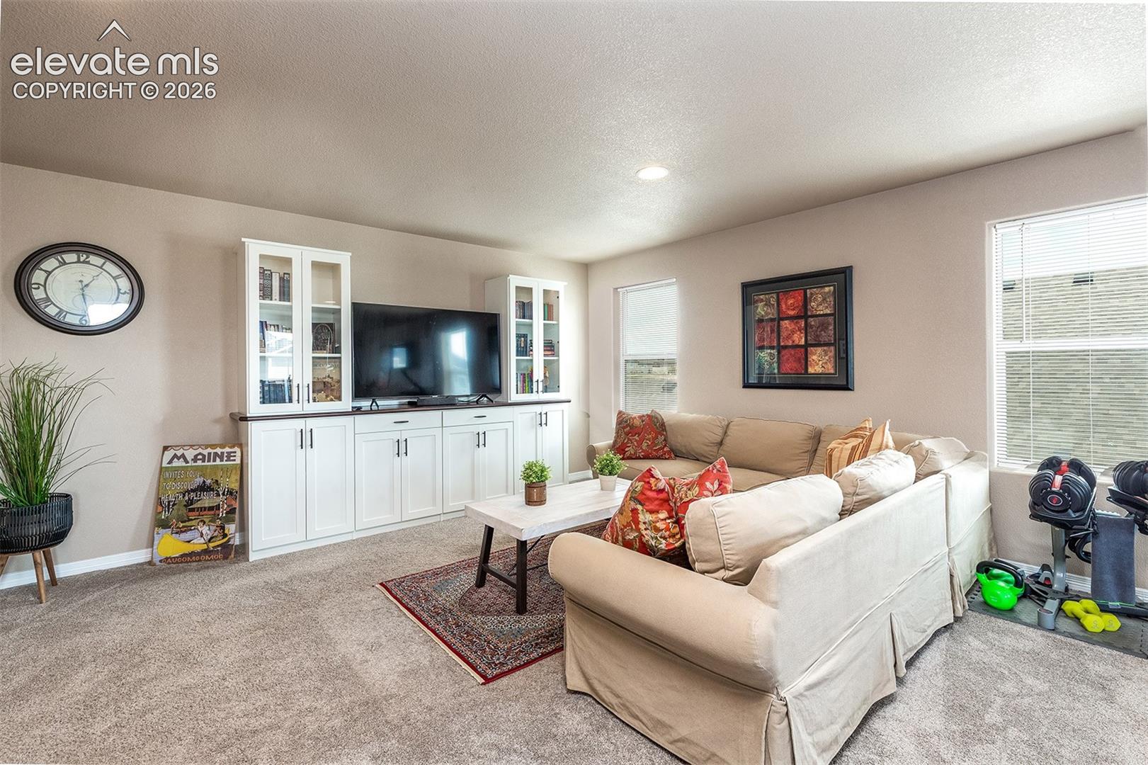 Upstairs, you’ll find a generously sized family room with beautiful built-ins and an additional flex space for a home gym, office, playroom, and more