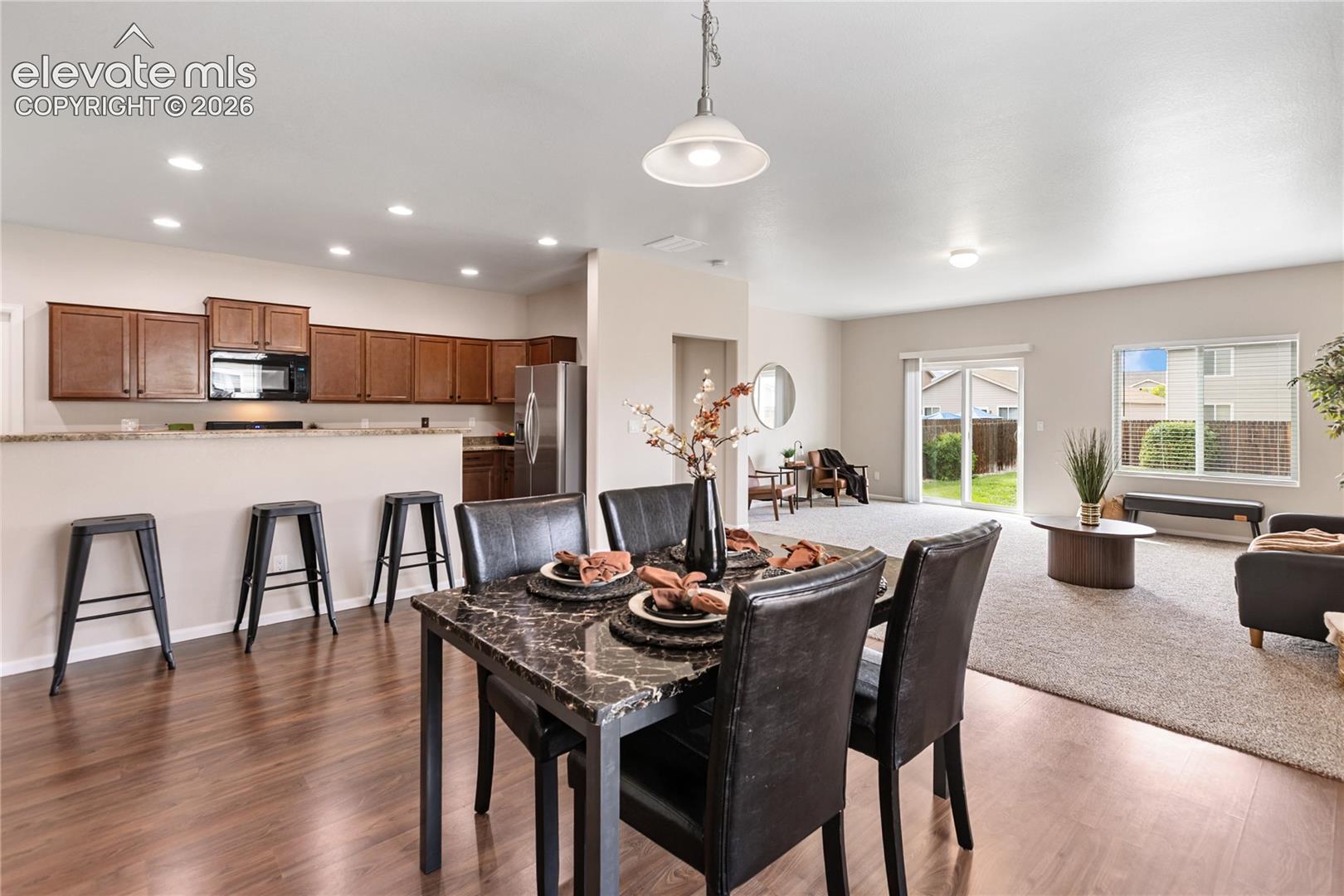 Beautiful open floor plan!  Sparkling clean, freshly painted inside and out and new carpet with upgraded pad!  