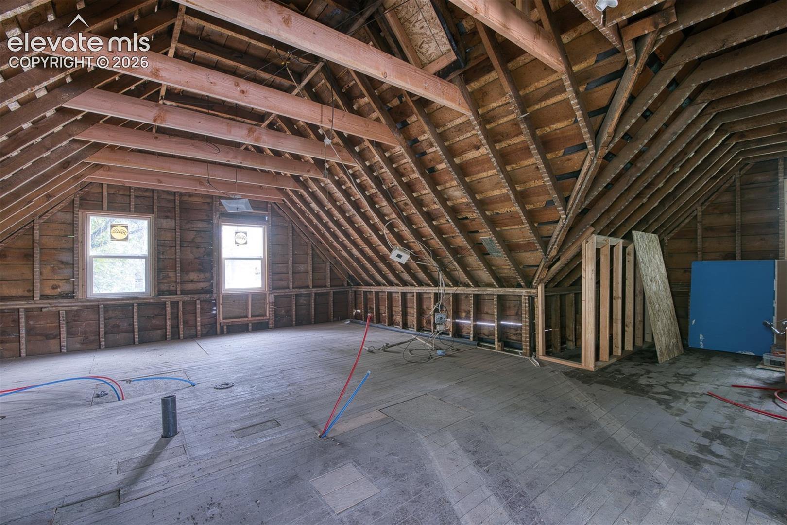 Large open areas and Higher beamed ceilings allow for many options to build out the upper level. 