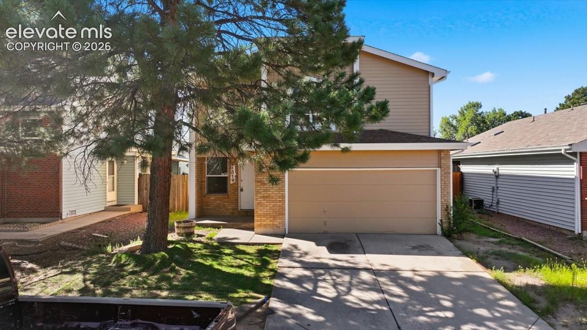 Daytime curb appeal with mature pine trees at , Colorado Springs, CO.