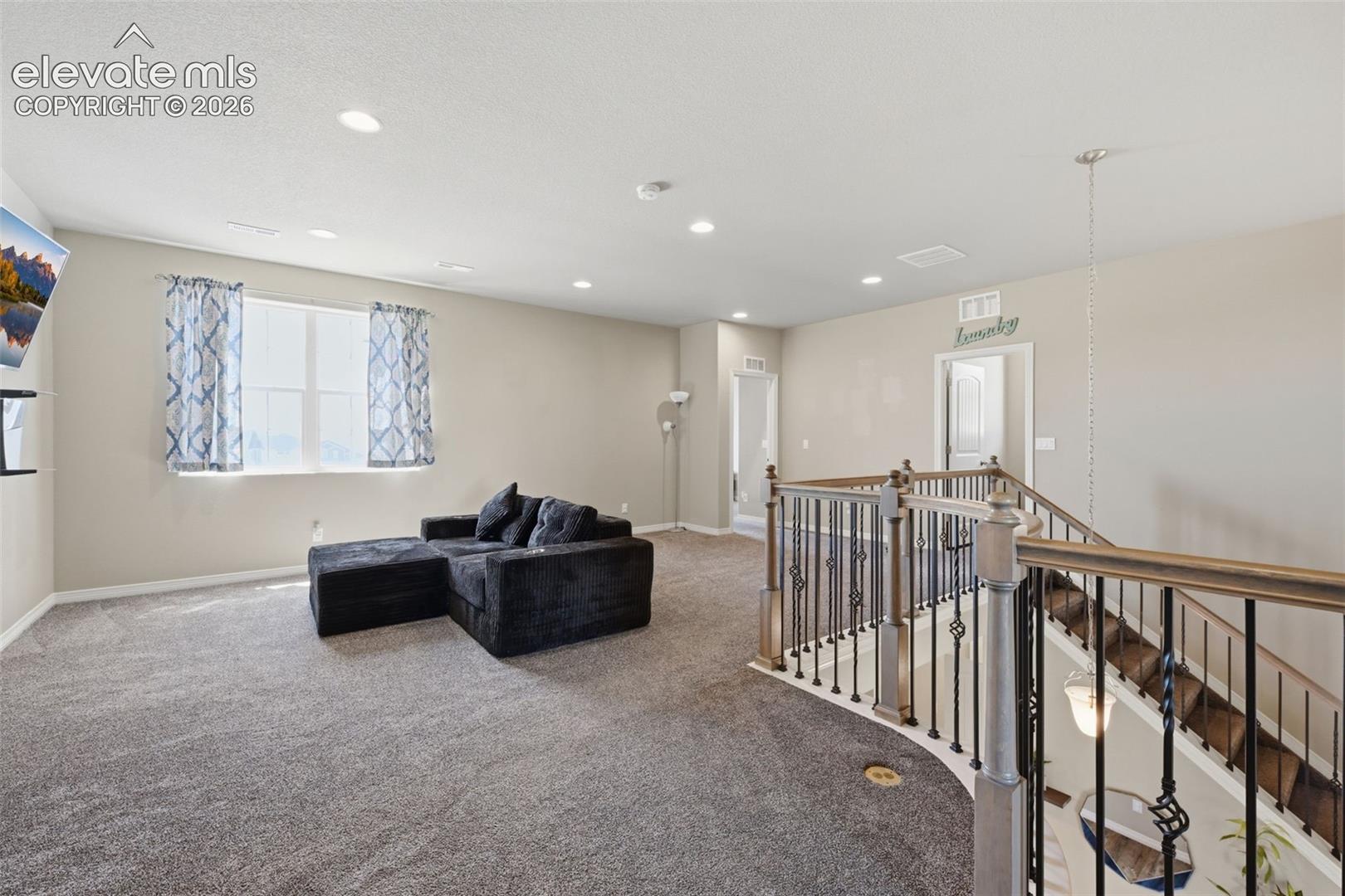 Large Upper-Level Loft Creates a Second Living, Media, Study or Play Space