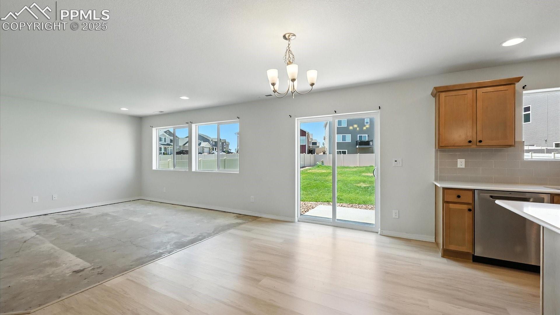 View of the walk out Dining Area and Living Room from the Living Room.