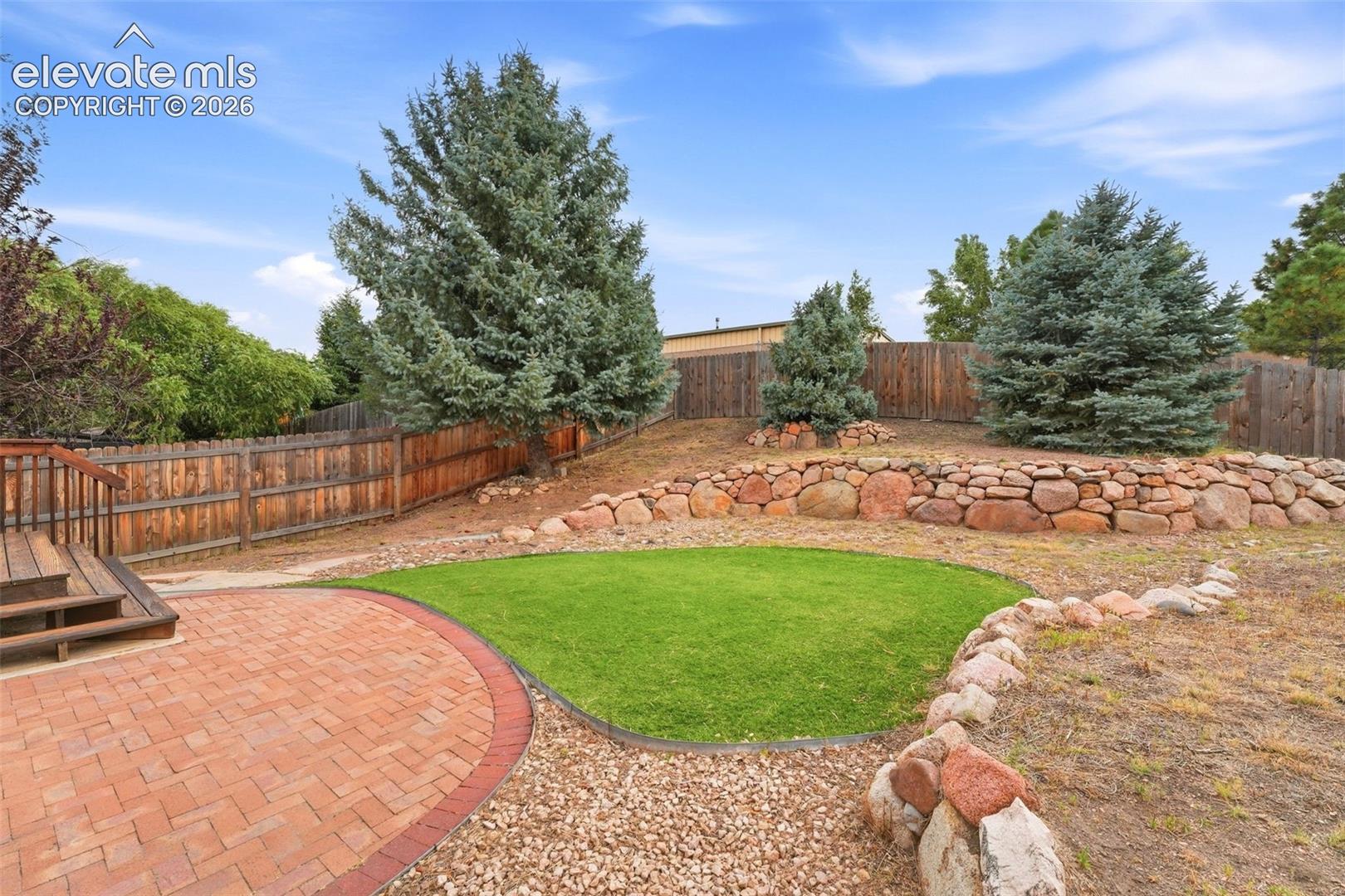 Mature Blue Spruces and Flagstone Patio