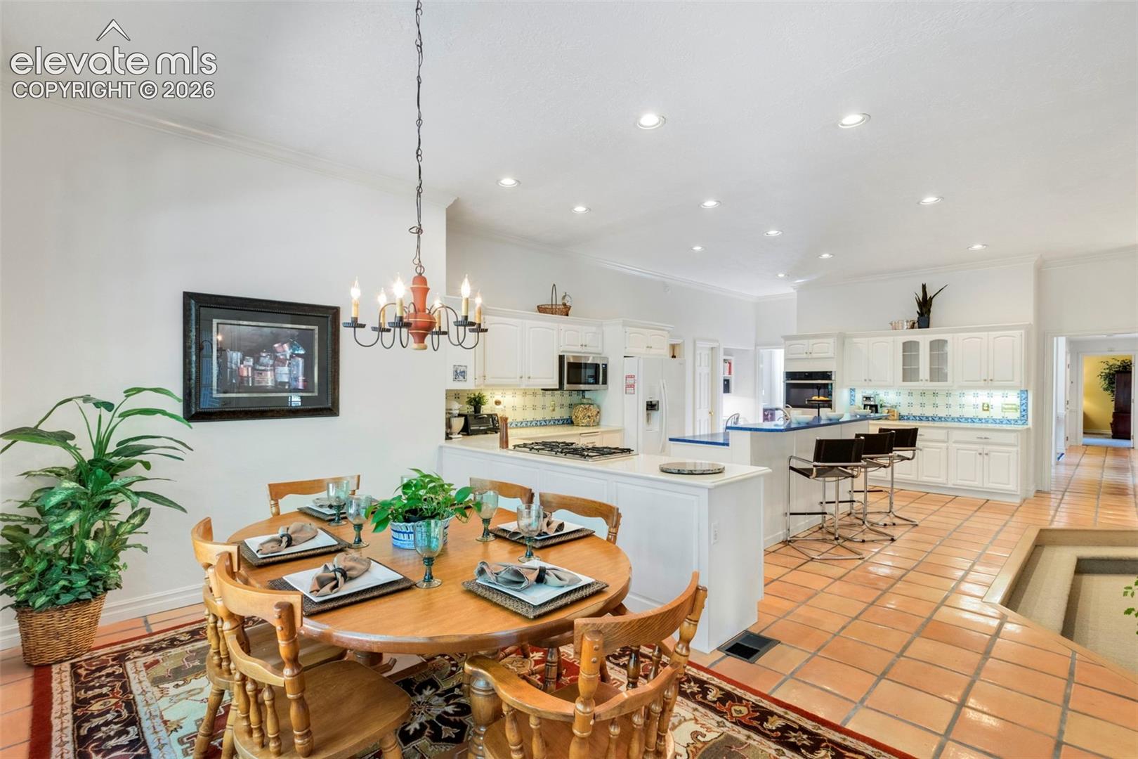 Casual dining area open to kitchena dn stepdown family room