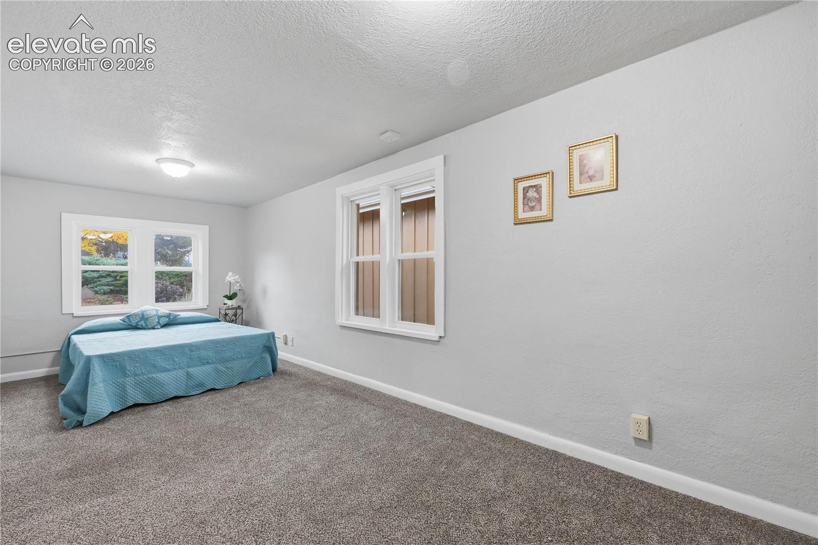 The large bedroom in the apartment portion of the home.