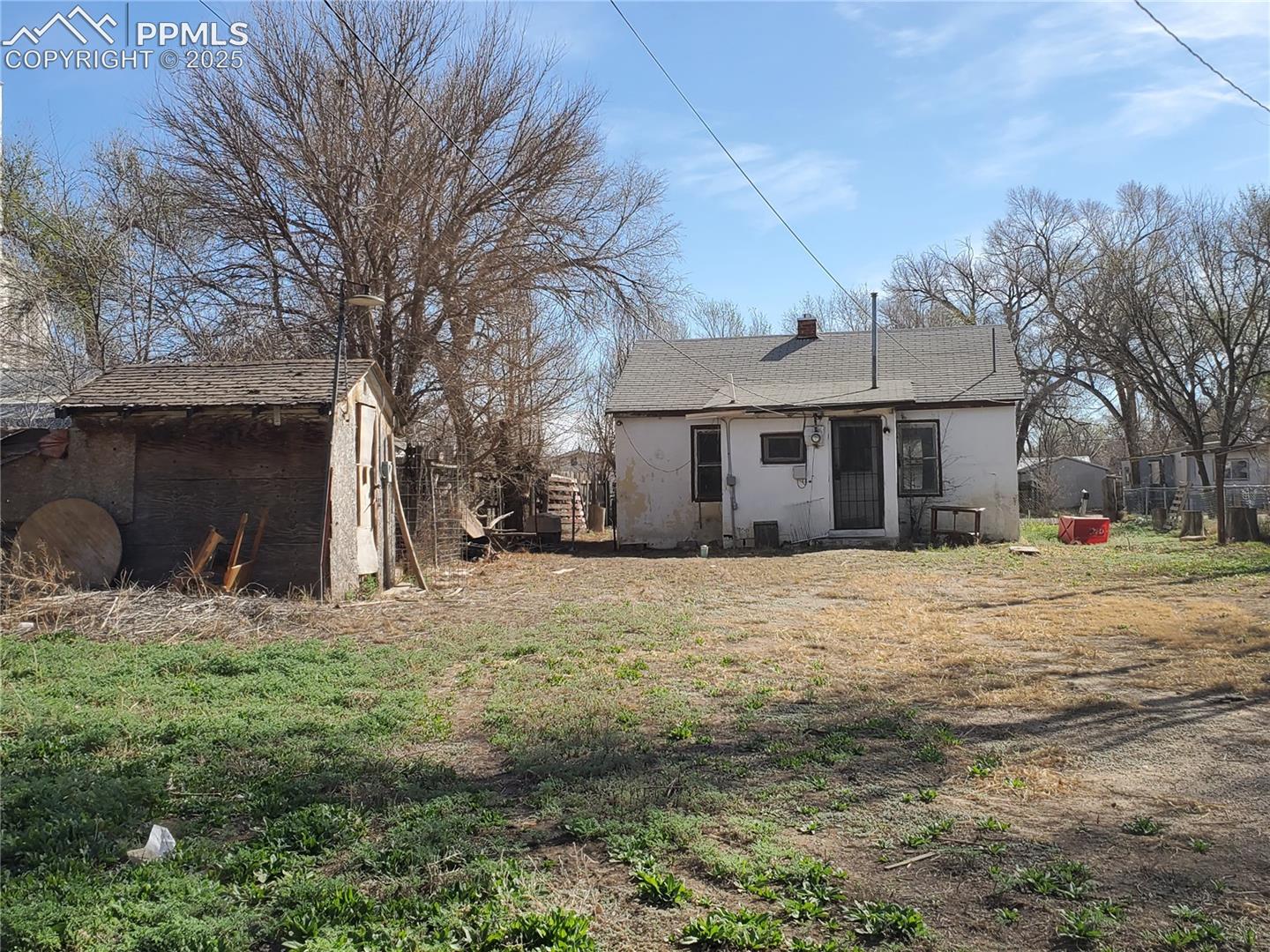 Back Exterior & Backyard (Small, Old Shed to Left)