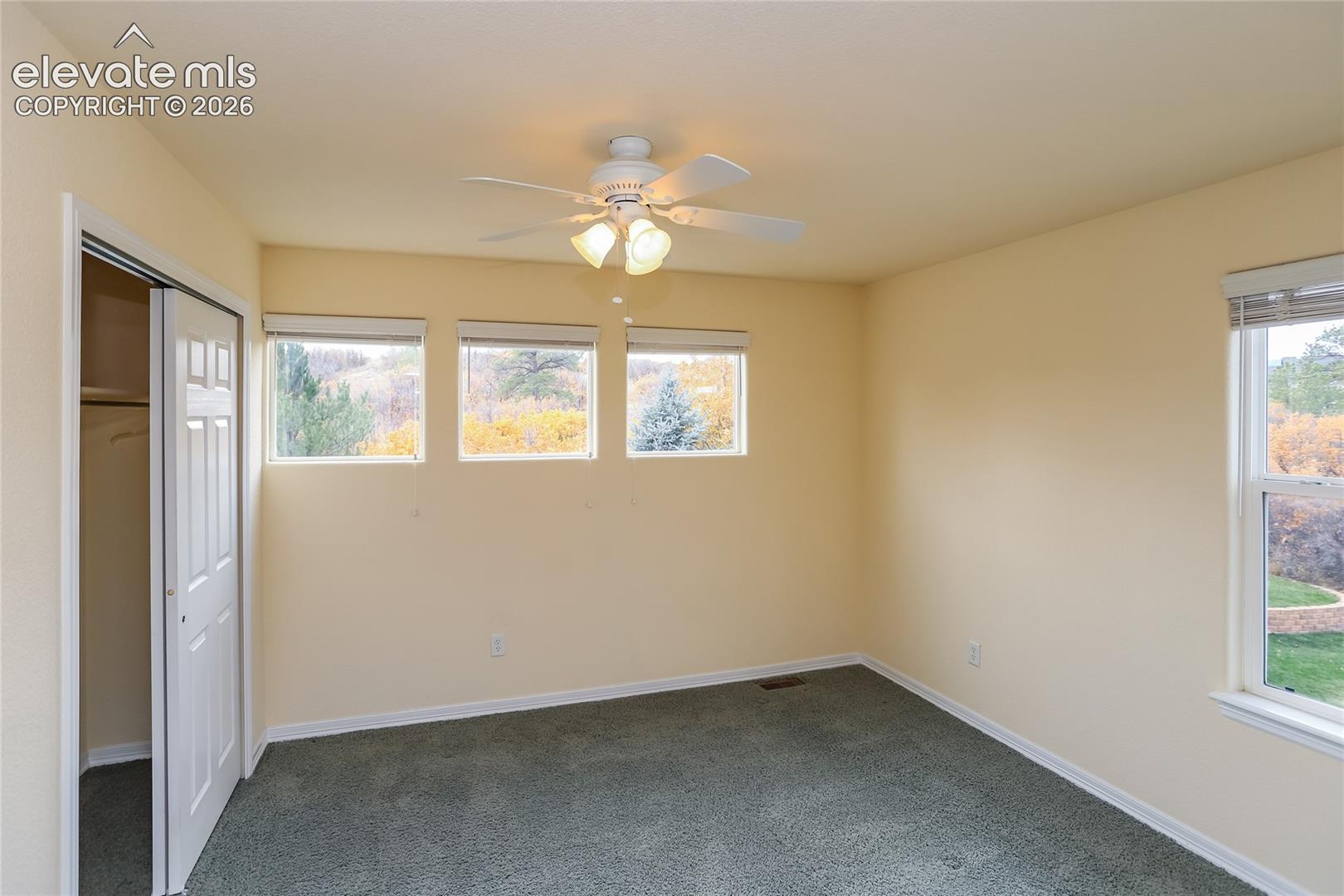 Bedroom 4 on the upper level has amazing views of the open space behind the home!