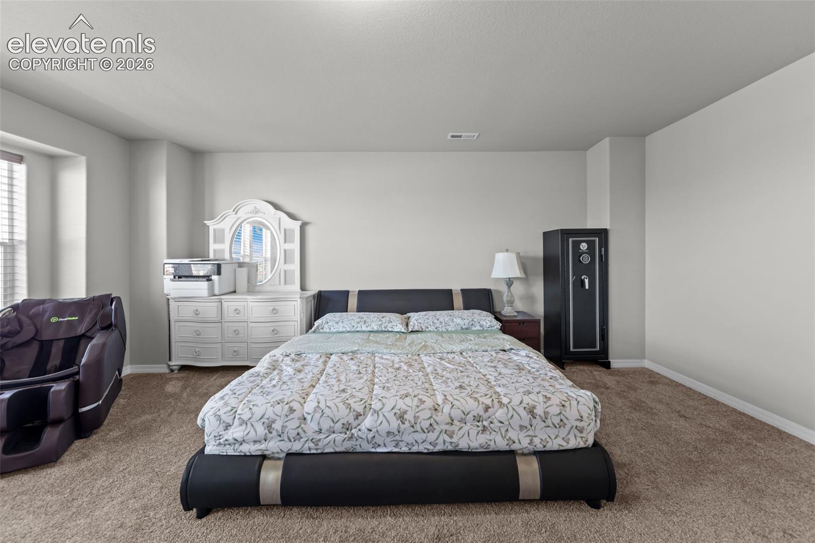 Neutral wall color with textured carpeting