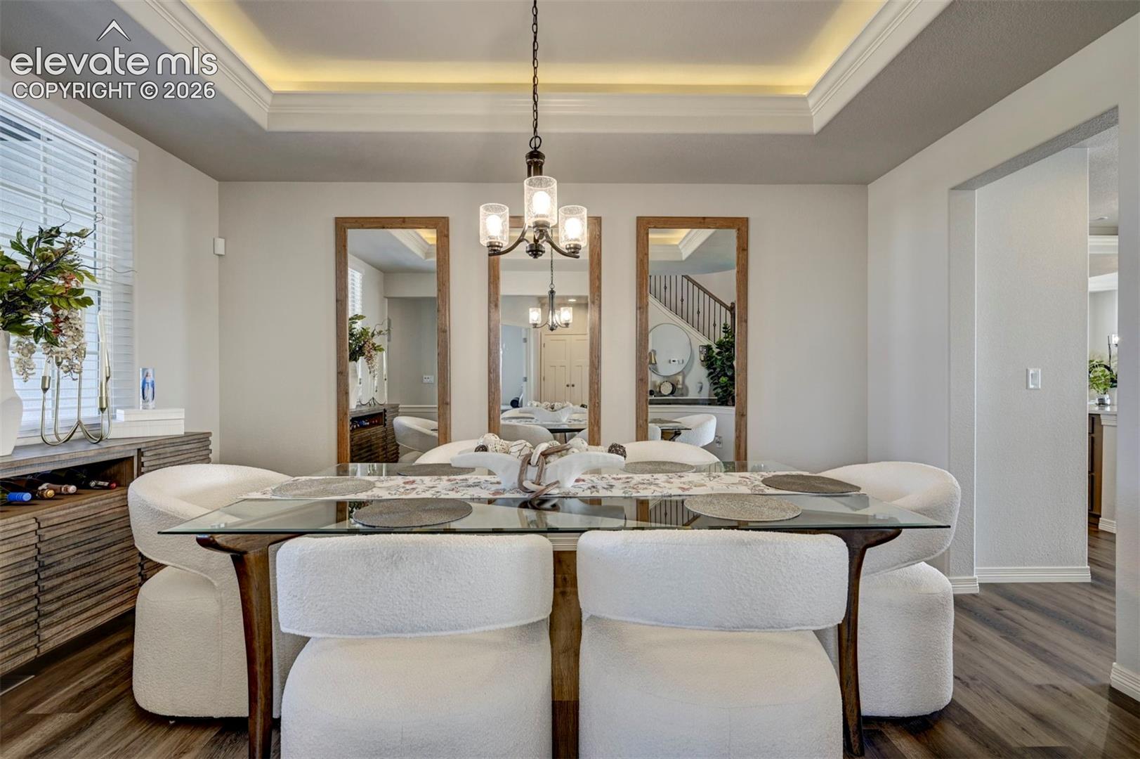 Tray ceiling with recessed lighting and crown molding