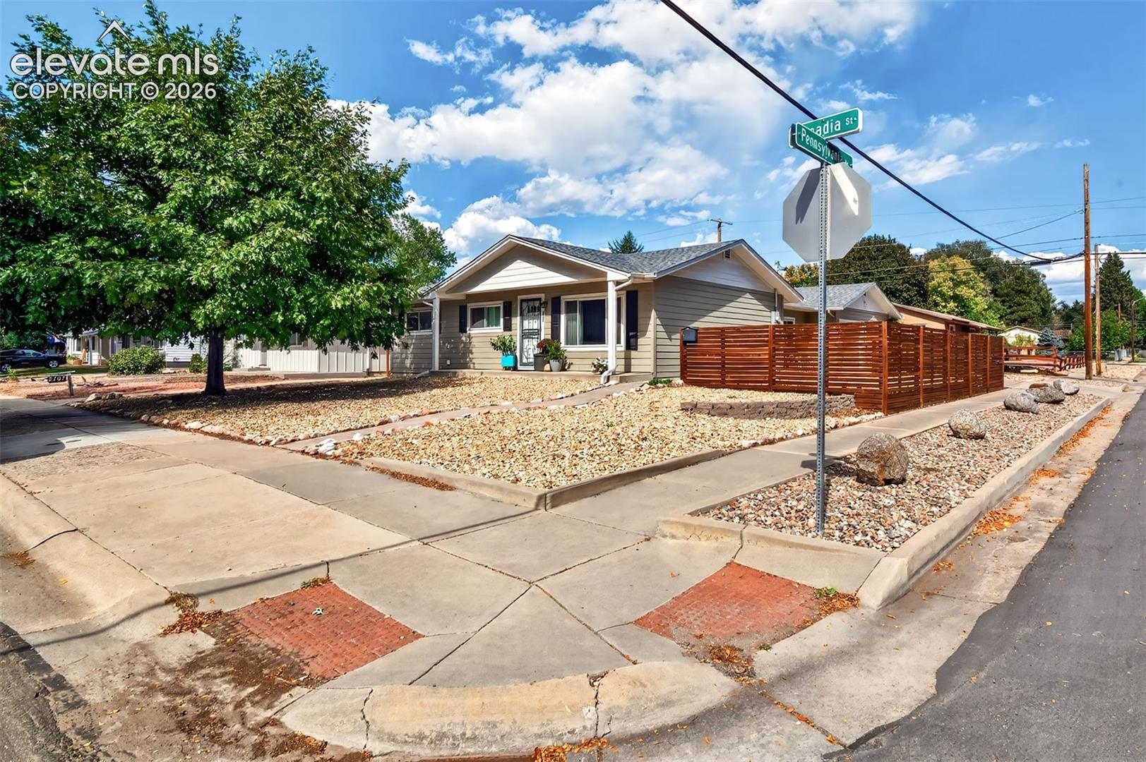 Large private corner lot situtated in a quiet neighborhood near Patty Jewett golf course, shopping, restaurants and Nancy Lewis Park horizontal siding, a pitched roof, and a privacy fence composed of horizontal wood slats