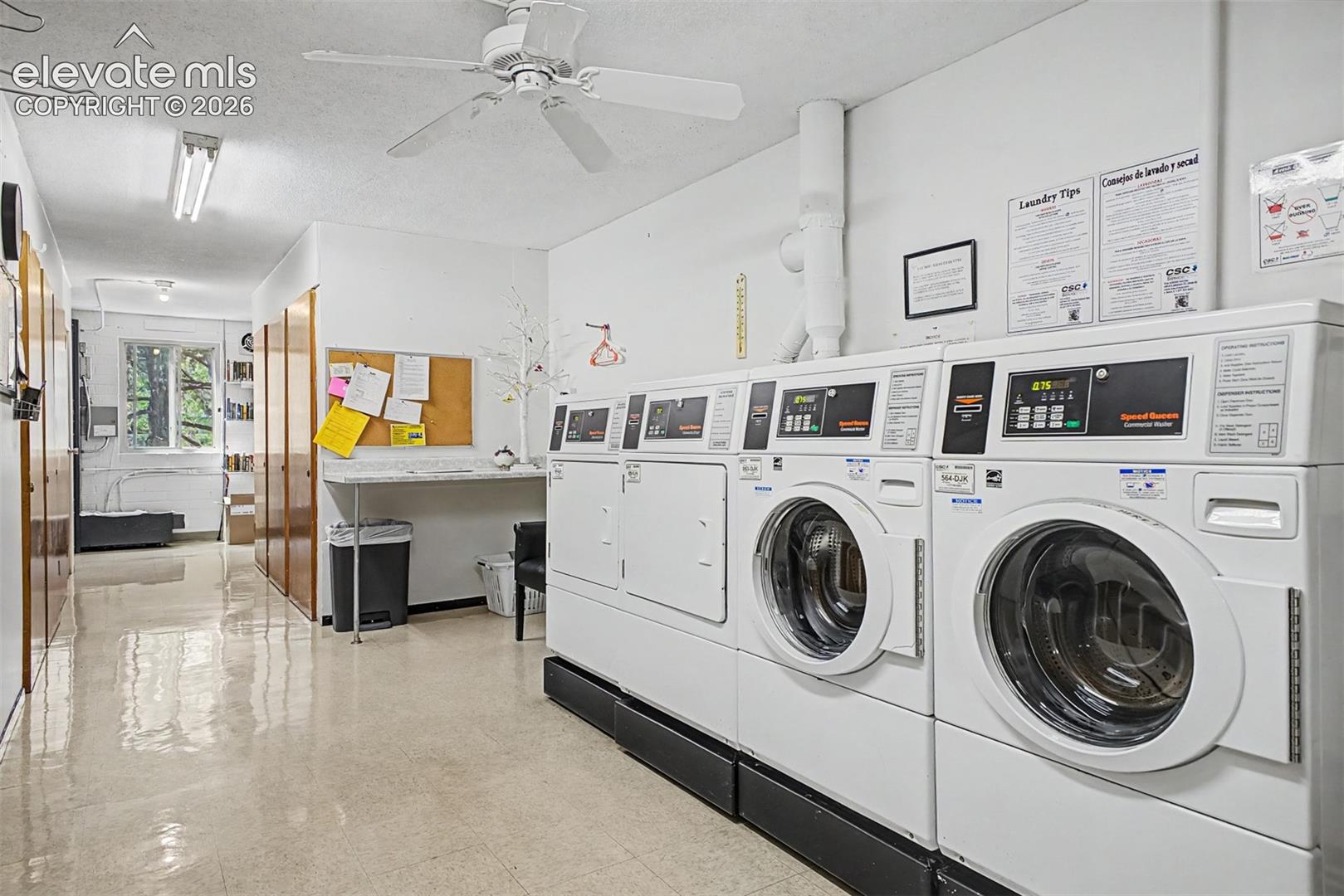 Dedicated laundry facility featuring multiple commercial-grade washers and dryers