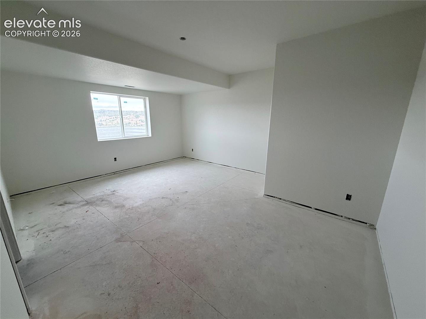 Lower Level Bedroom 2 is a secondary Primary Suite with 3/4 Bath with Double Sinks and Walk-in Closet