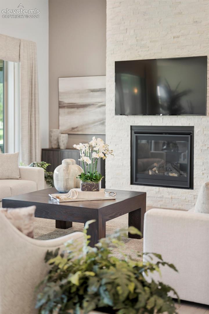 Floor-to-ceiling stacked stone fireplace 