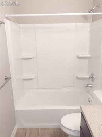 Full bath with vanity and tub / shower combination