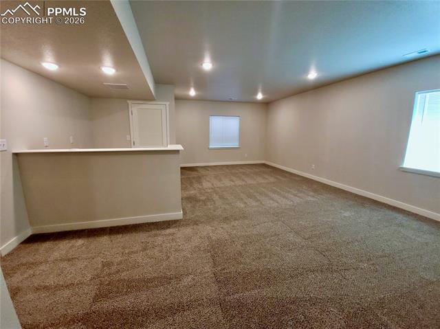 Large basement rec room with pre-plumbed wet bar