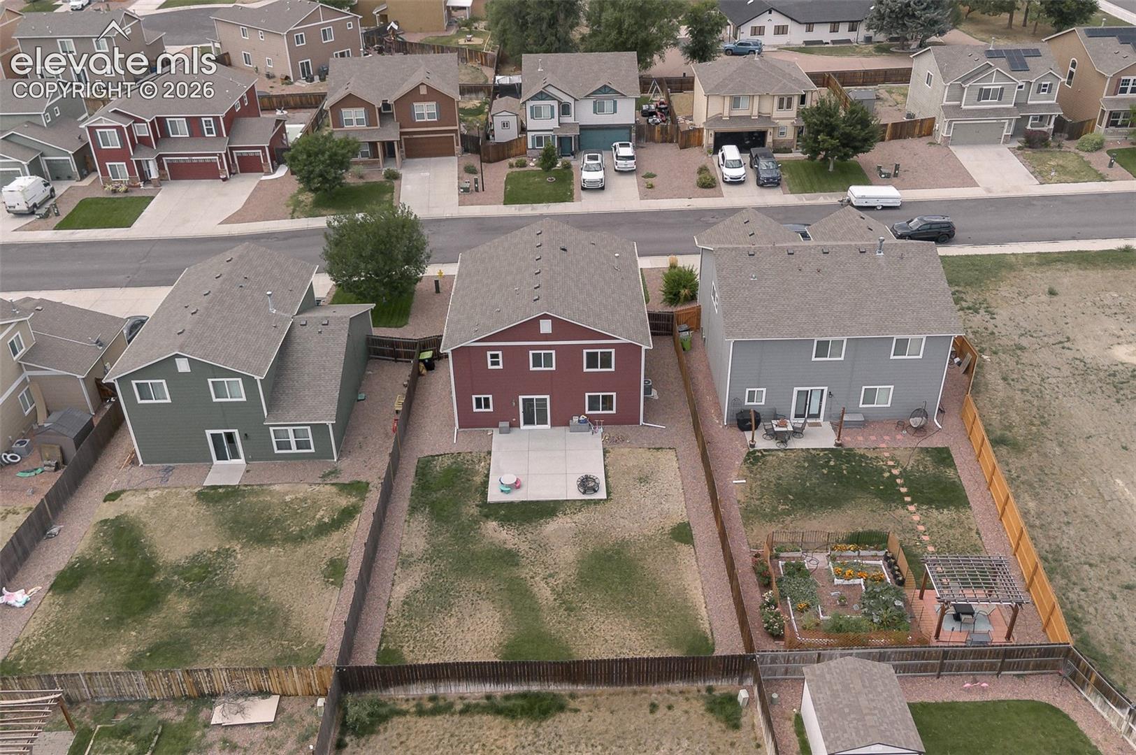 Aerial rear view of home and yard.