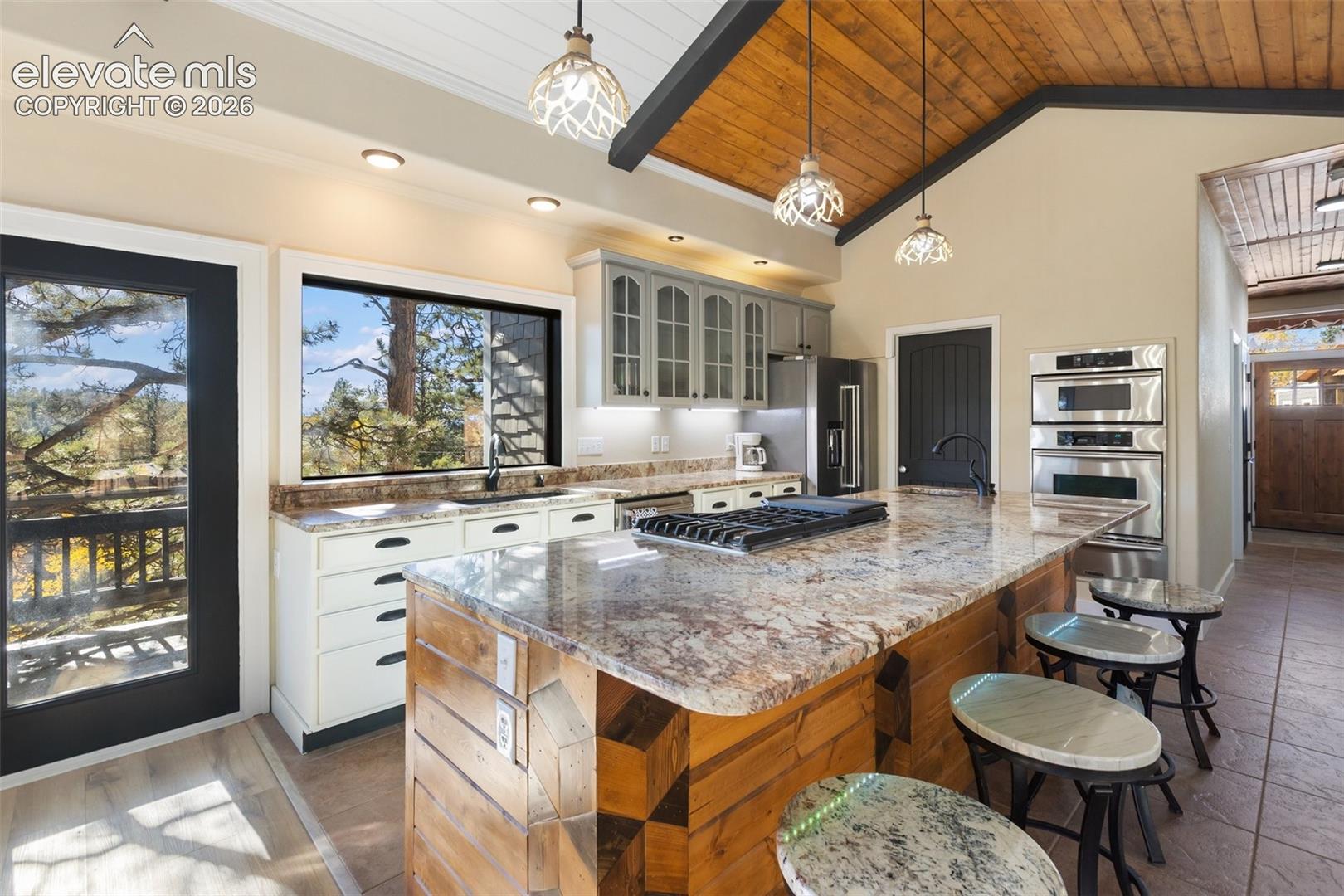 Kitchen with breakfast bar, vaulted ceilings