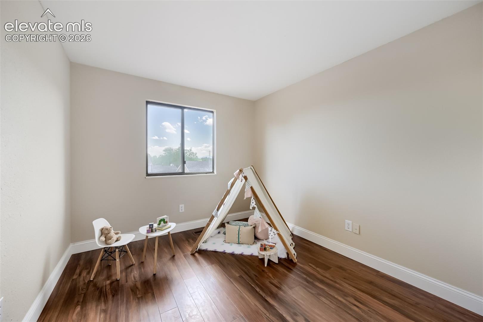 Second bedroom with nice sized window and new floors