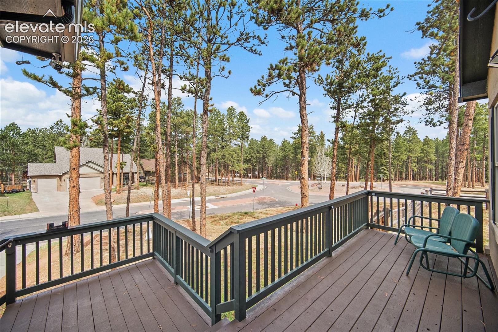 Spacious deck surrounded by mature pines