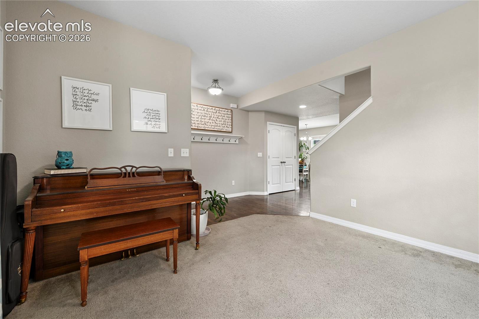 The home office or reading room just inside the front door is nearby the main living spaces, but tucked away just a little to provide some separated spaces.