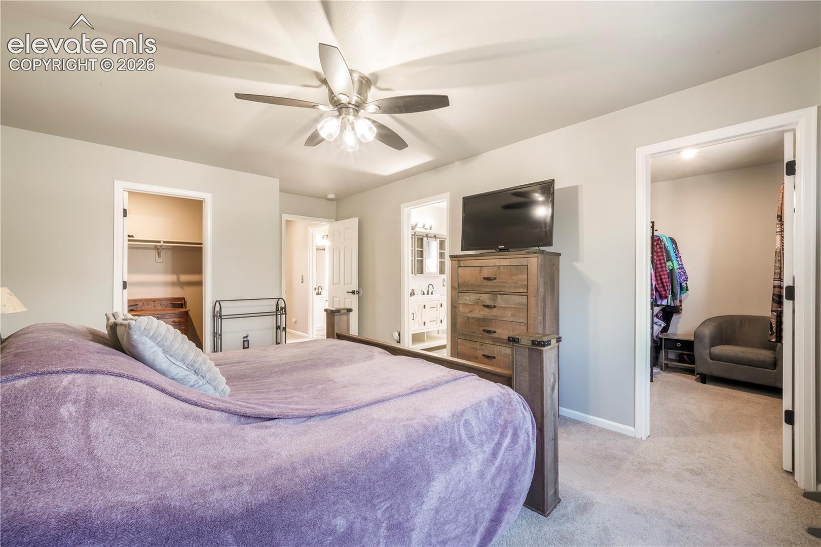 Upstairs Primary bedroom with views of Pikes Peak, 2 closets and updated bathroom