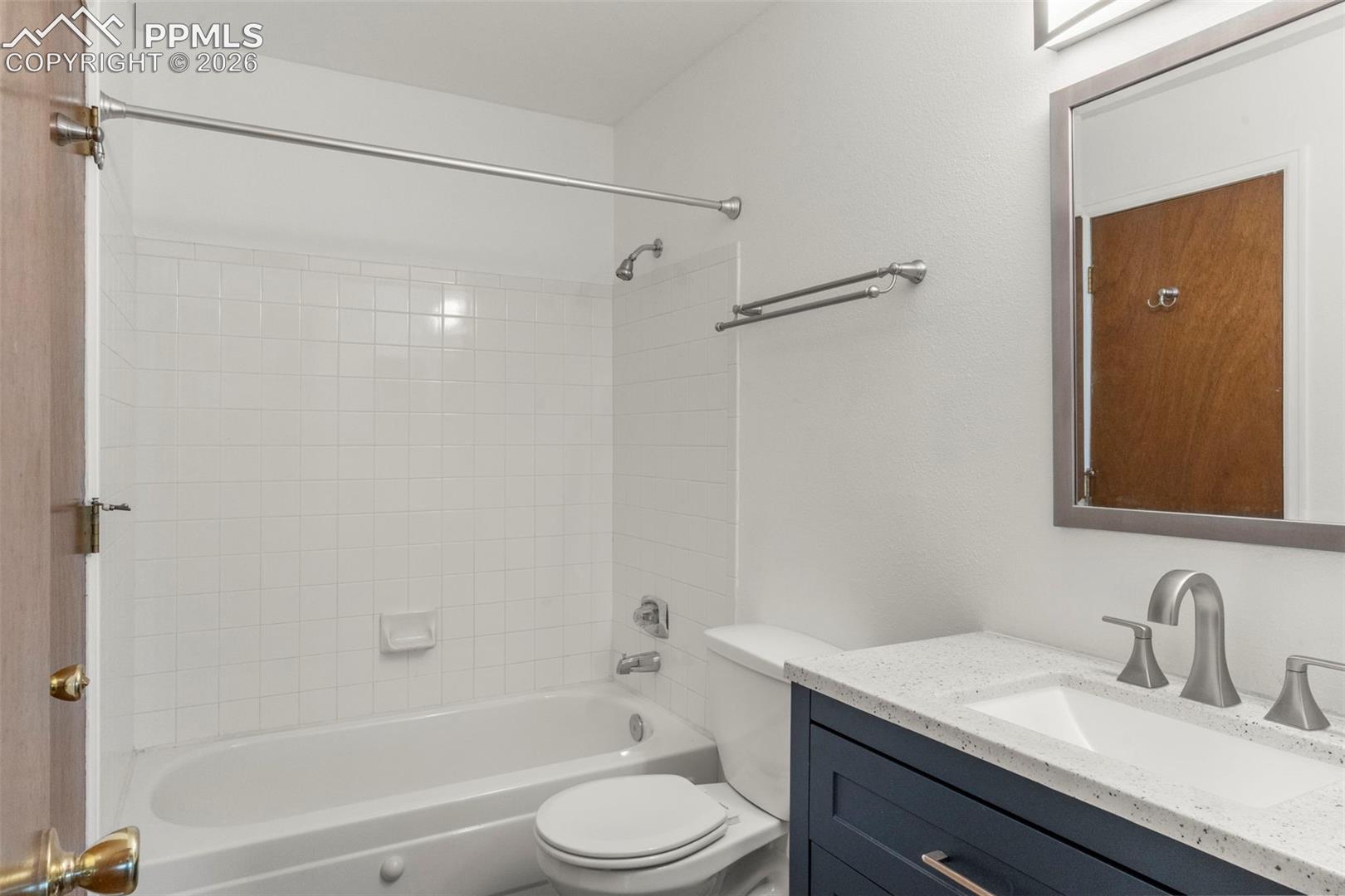 Full bathroom featuring vanity and shower / bathtub combination