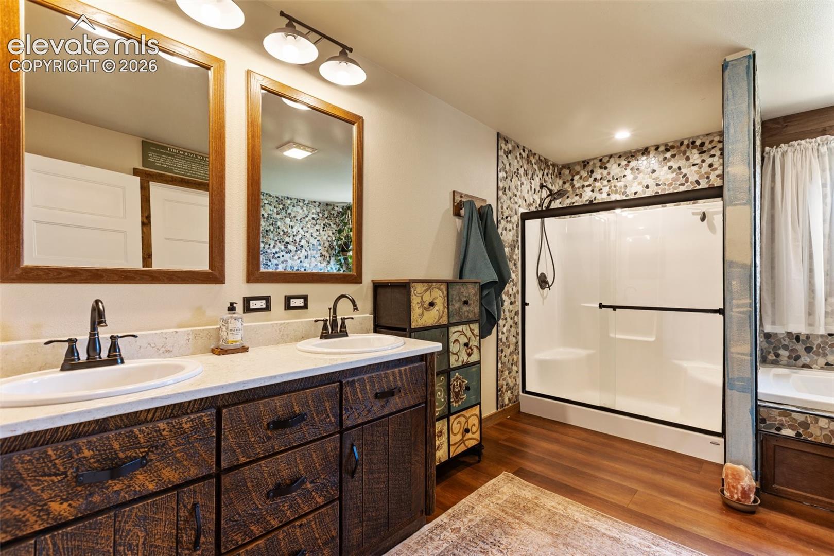 Primary ensuite bath with walk in shower and tub