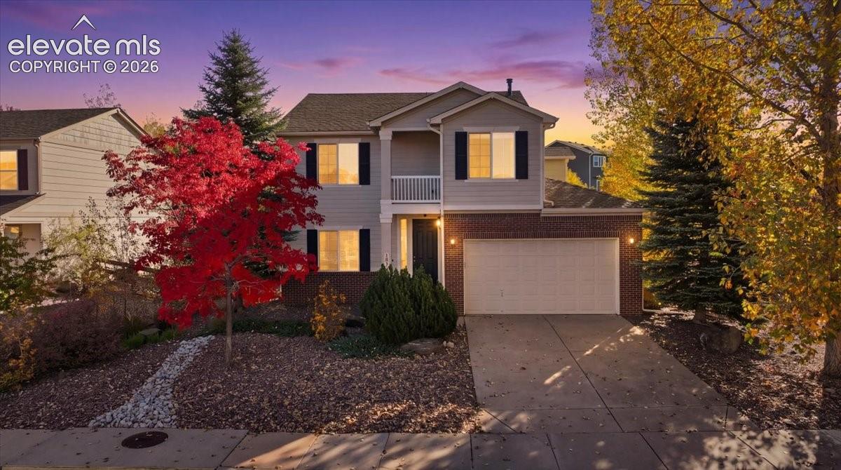 Welcome home to this lovely Jackson Creek property! This 2-story home has plenty of room to spread out.  Recently painted throughout, this home features high ceilings and two living spaces on the main level which are great for entertaining and includes a powder bath for guests. The bright and open kitchen showcases granite countertops, double oven, range top, and spacious pantry.  The main level has upgraded LVP flooring, a beautiful fireplace with custom mantel, and large windows to let in natural light. Step right outside to an incredible Trex deck and turfed backyard that has mature trees. The home has recently been given a fresh exterior paint update. Upstairs you will find a roomy master bedroom with attached bathroom and private sitting porch that has views of the Front Range. Two additional bedrooms upstairs, along with a full bathroom and laundry make for convenient living. Downstairs, the basement boasts a spacious rec-room space, wet bar, additional bedroom, and full bathroom. The tandem 3- car garage has plenty of room for storage and vehicles. This home has easy access to walking trails, a park and playground across the street, and convenience to shopping, dining, and easy access to I-25. This home is move-in ready! No need to do any updates, maintenance or renovations!