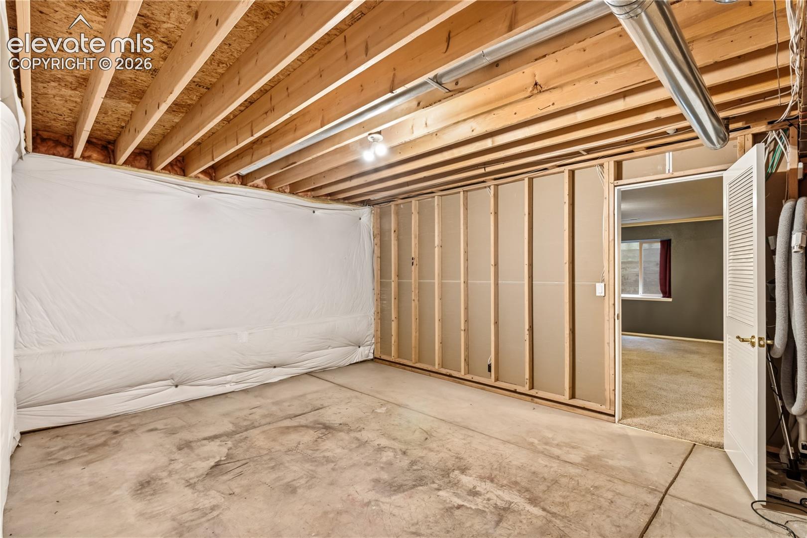 unfinished storage space is perfect for a workshop