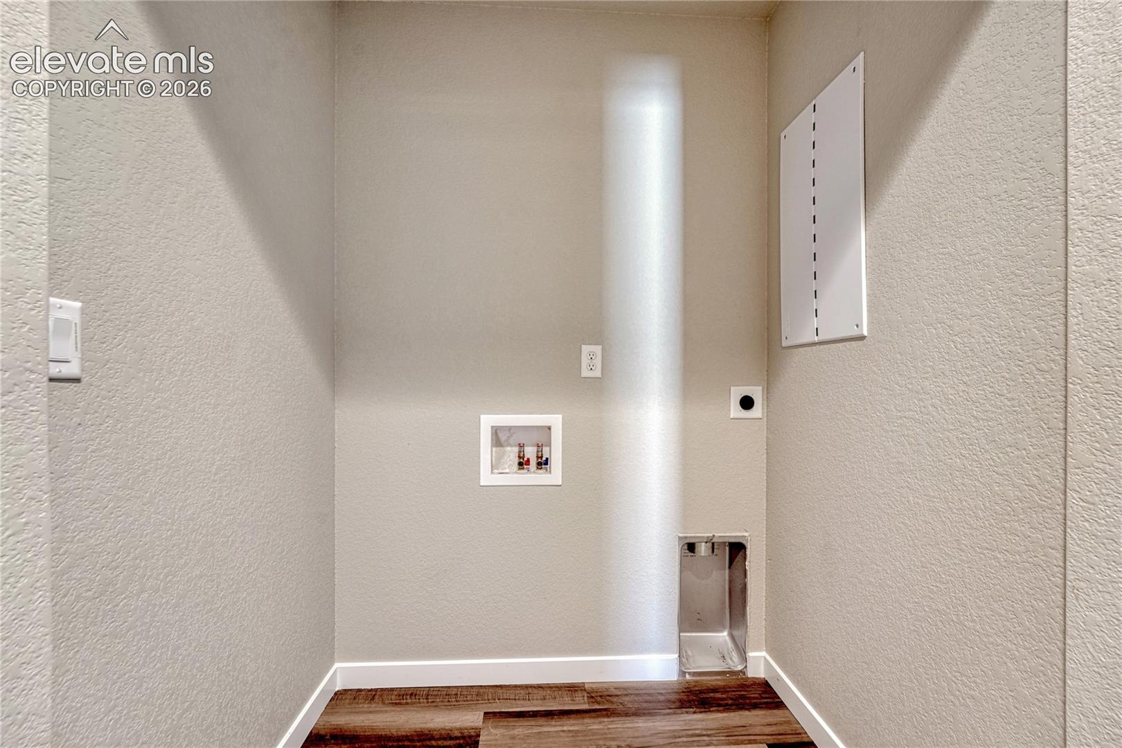 Upstairs laundry space.