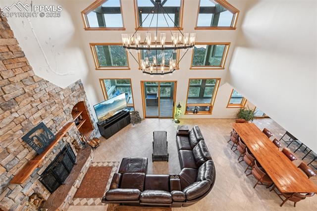 Living room view from the upper level. Just look at the newer chandelier and the views!!!