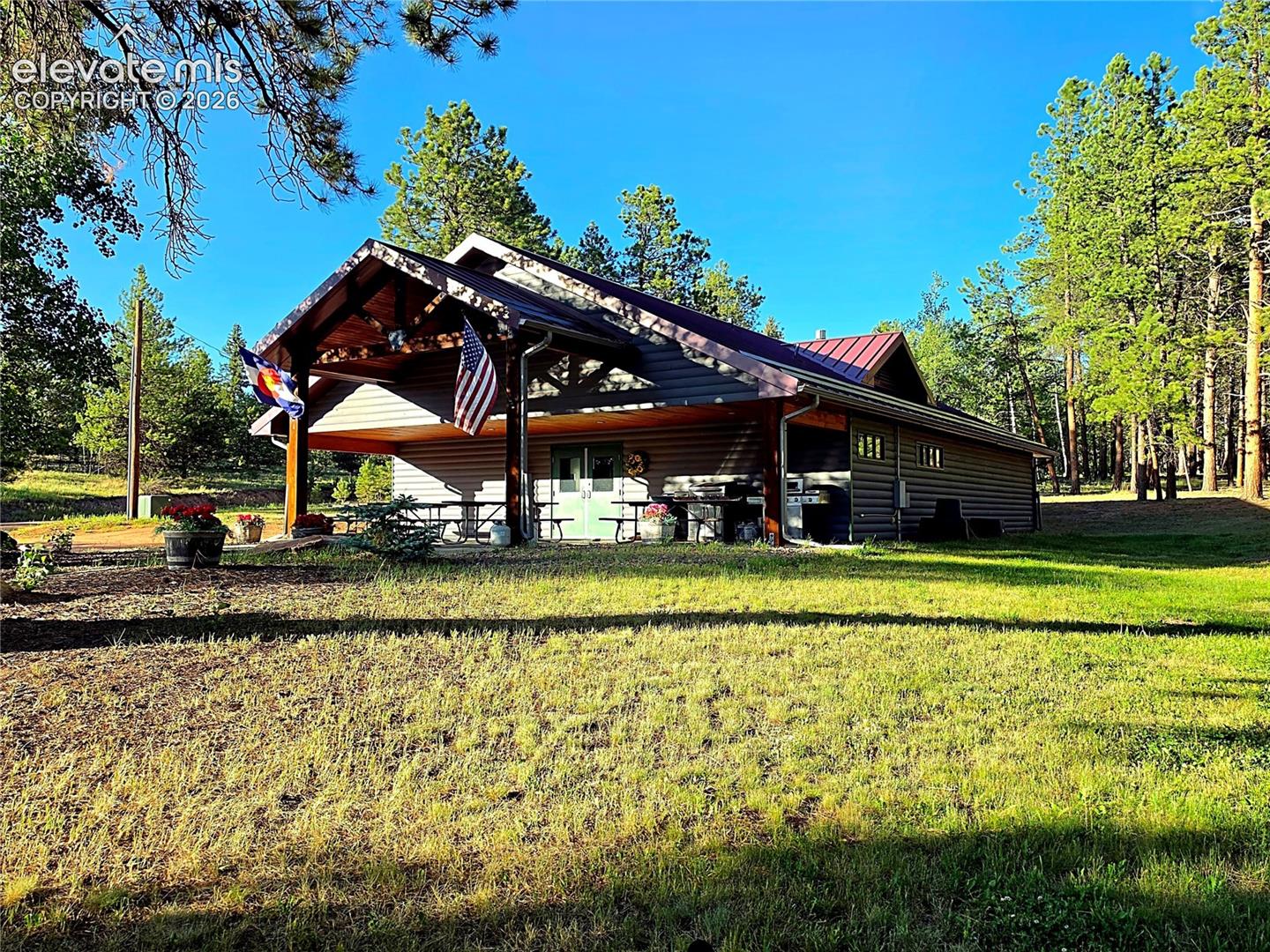 Bath House with covered patio and kitchen and storage.
