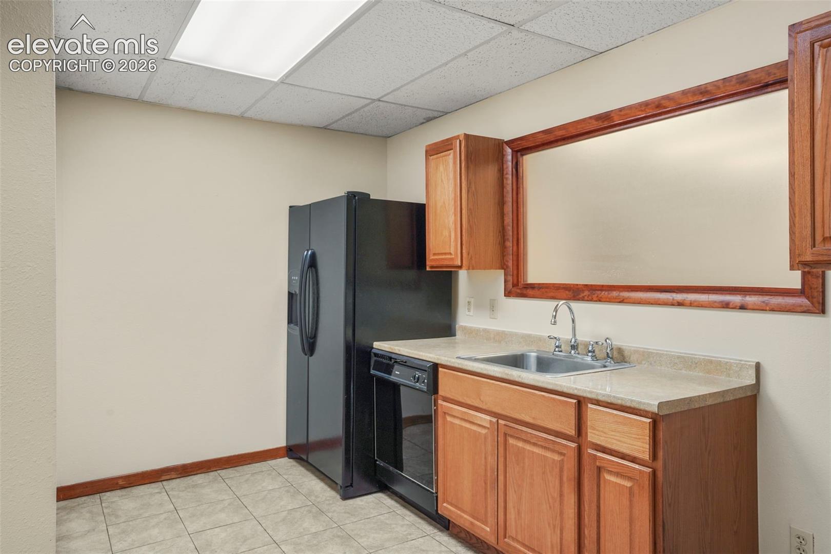 West side kitchen with refrigerator and dishwasher. Plenty of room for small table.