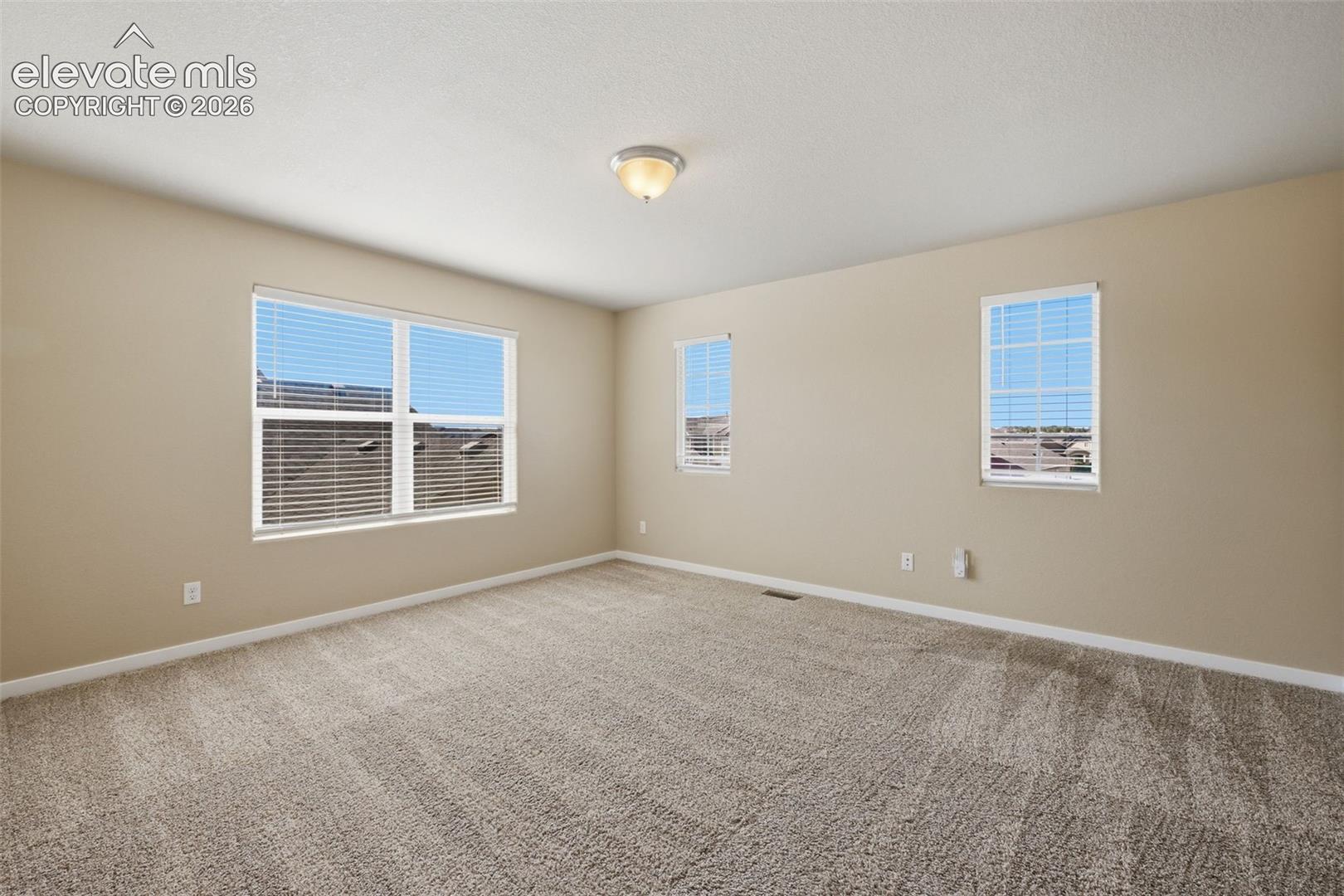 A generous upper-level loft provides valuable separation from the main living area below.