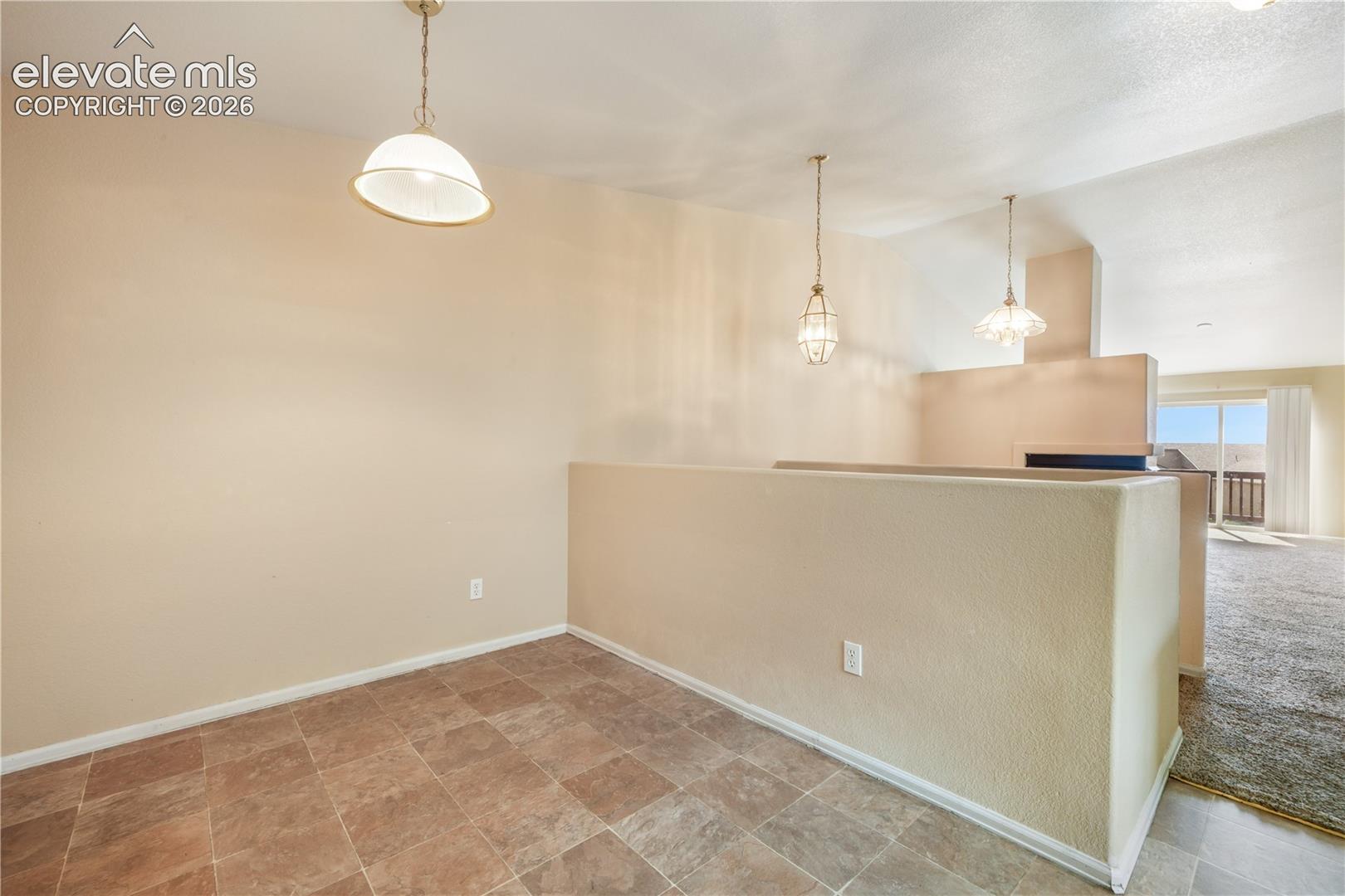 Kitchen eat in area and access to the garage
